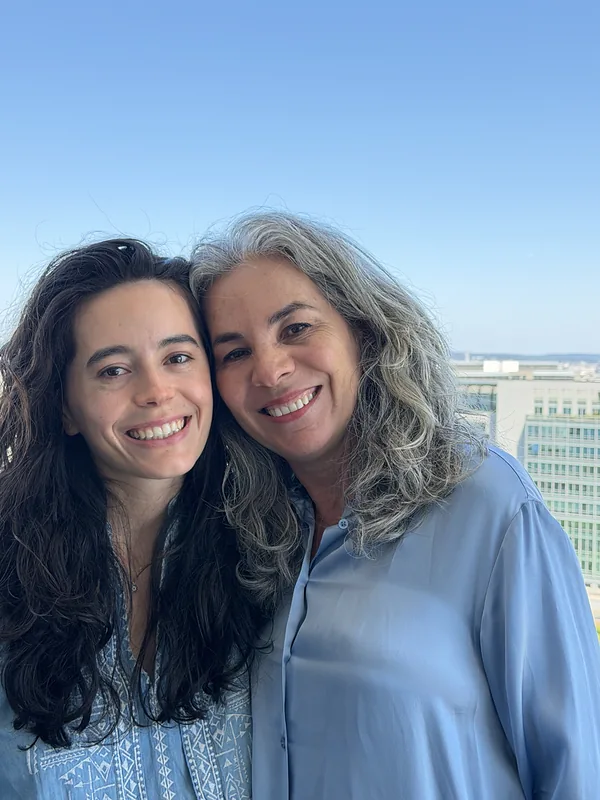 Juliana Sofía and Maritza cheek to cheek, above Paris